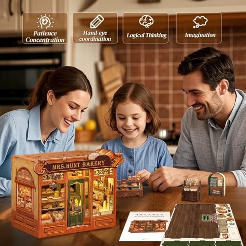 Family assembling a miniature bakery model together at a table.