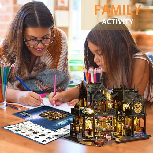 Mother and child engaged in a crafting activity with a miniature house model.