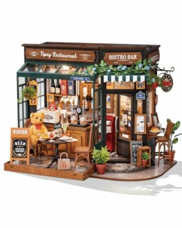 Miniature bistro bar with detailed interior and teddy bear.