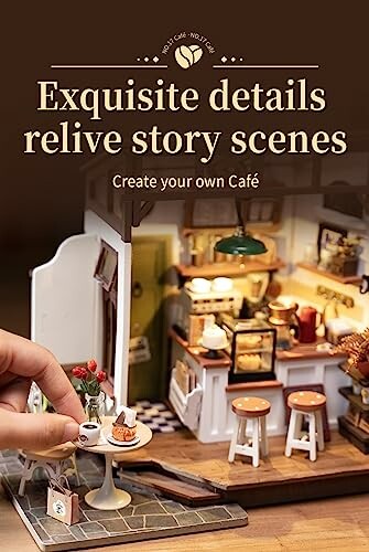 Miniature cafe scene with detailed interior and tiny furniture.