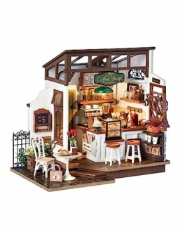 Miniature coffee shop diorama with detailed interior and furniture.