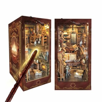 Miniature library diorama with bookshelves and detailed interior.