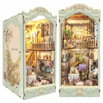 Intricate vintage-style dollhouse book nook with multiple rooms and detailed decor.